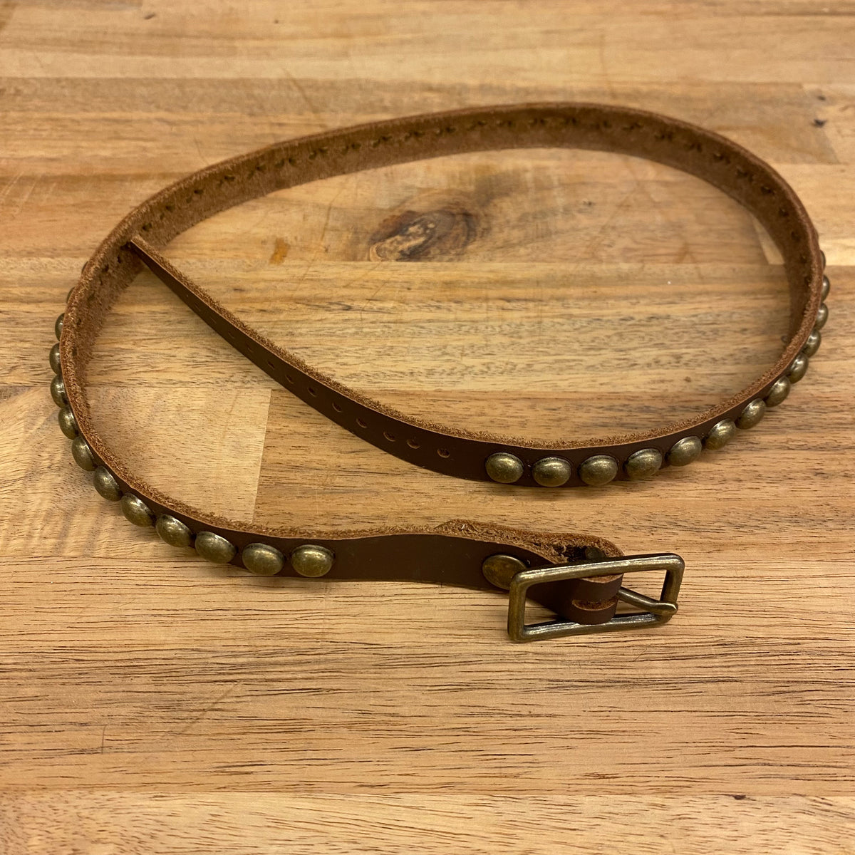 old west leather with brass studs