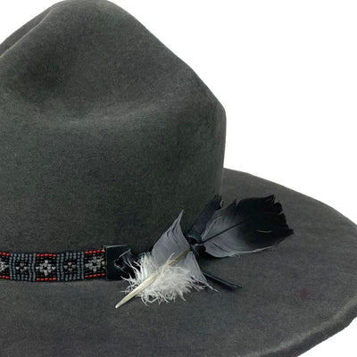 hatWRKS original with beaded hatband with a pigeon feather
